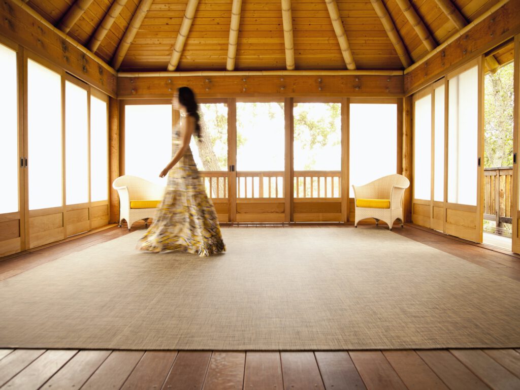 Asian woman walking in empty retreat